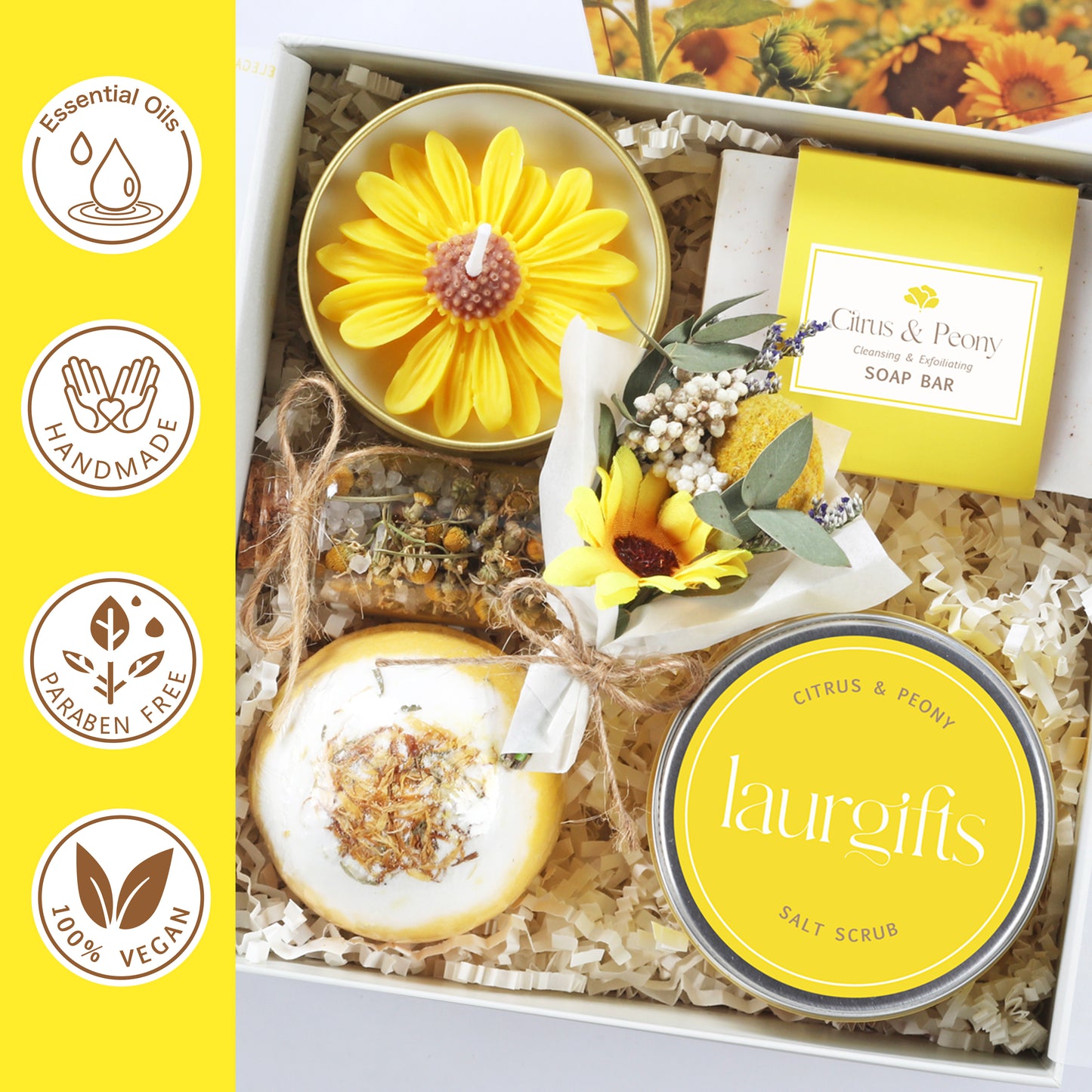 Gift set with sunflower-themed products including candles and soap bar, on a yellow background with brand logos.